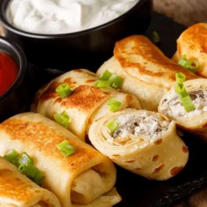 Млинці з куркою,сиром та грибами